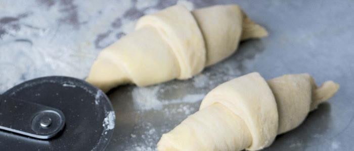 Croissant dough on a baking tray